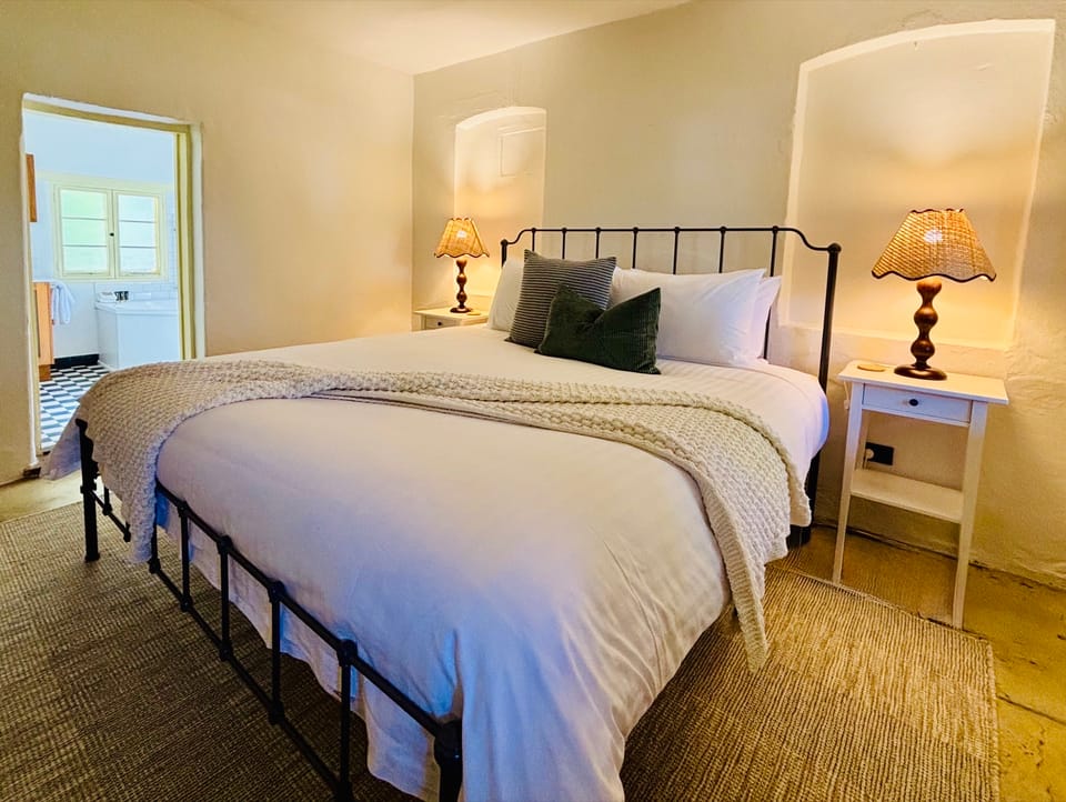 Image from one side of the master bedroom (one king size bed) in the Flaxman cottage.