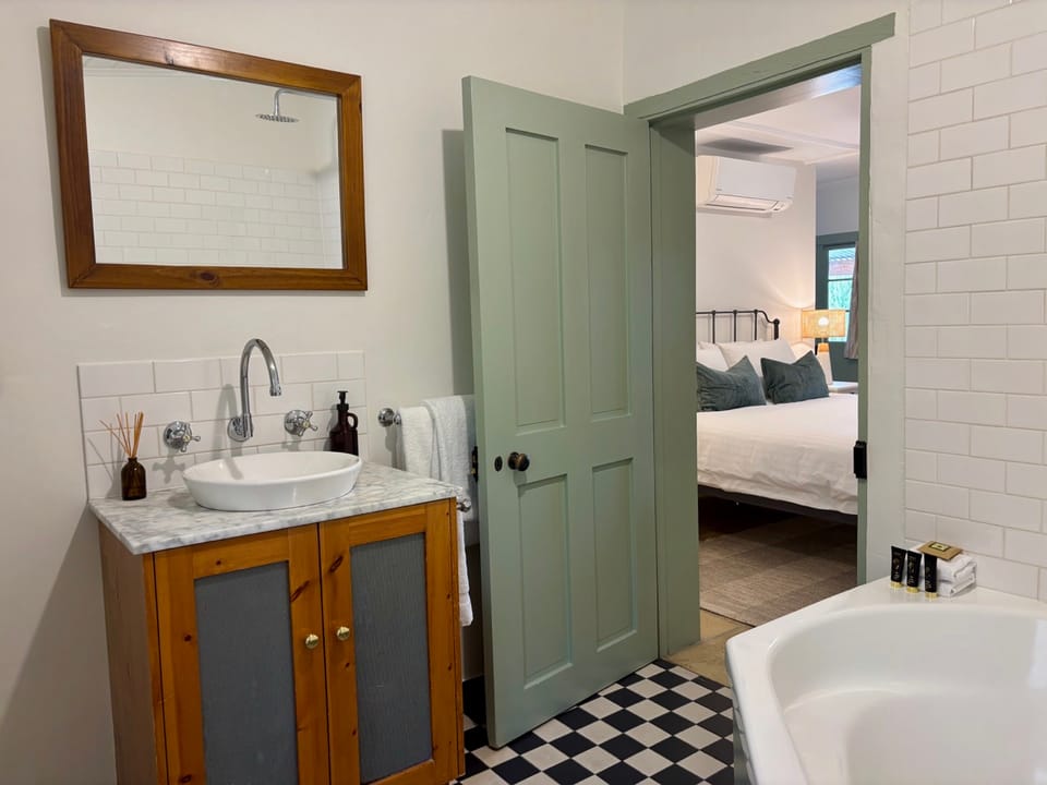 Image of the bathroom looking into the bedroom in the Menge cottage.